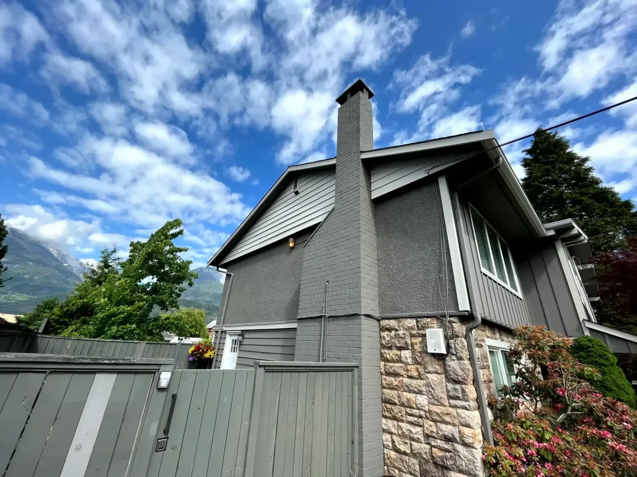 Home exterior side profile with cedar shingle siding