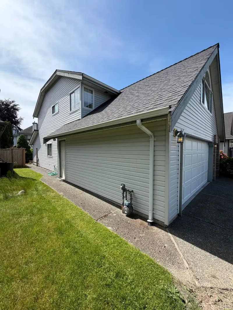 Before side and garage trim view at this Ladner home in Delta, BC