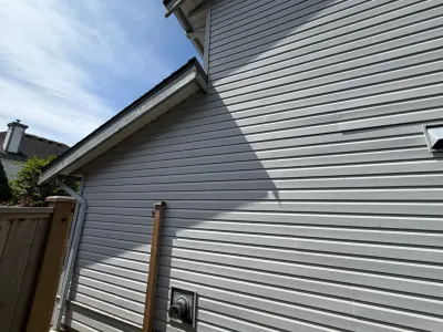 Before gable trim and adjacent vinyl siding at this Ladner home in Delta, BC