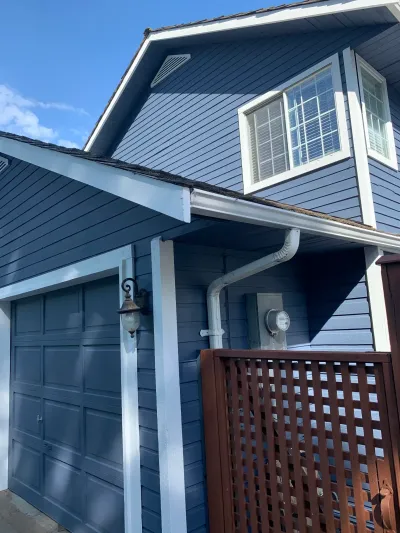 After: Navy blue siding with red door and white trim, Brackendale Squamish BC