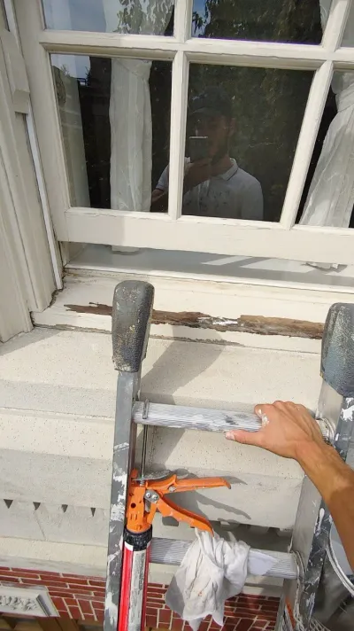 Before: Front window sill with visible rot before repair, ladder in front, Central - Granville St, Vancouver, BC