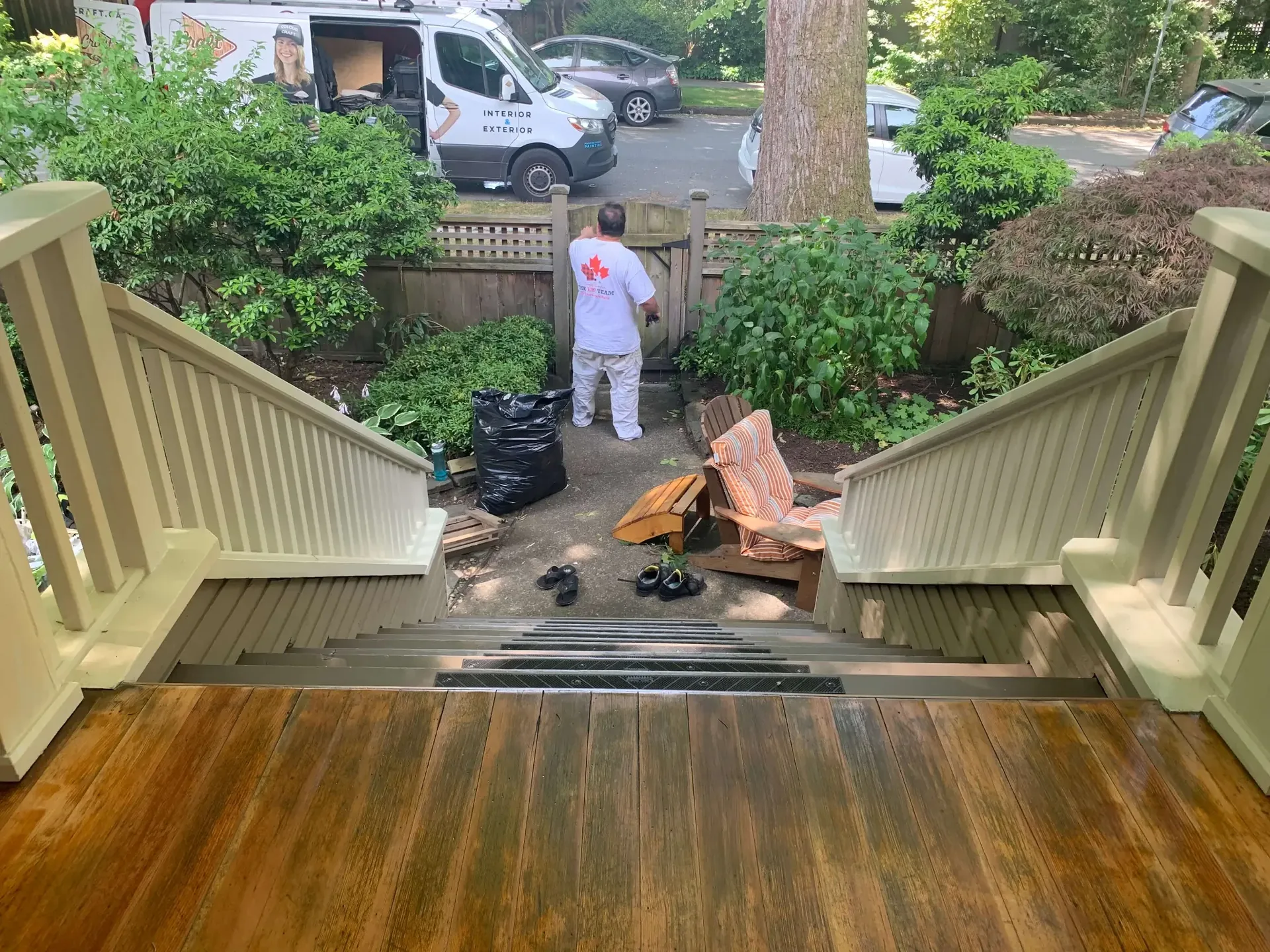Before deck staining, Colour Craft crew preparing weathered deck boards
