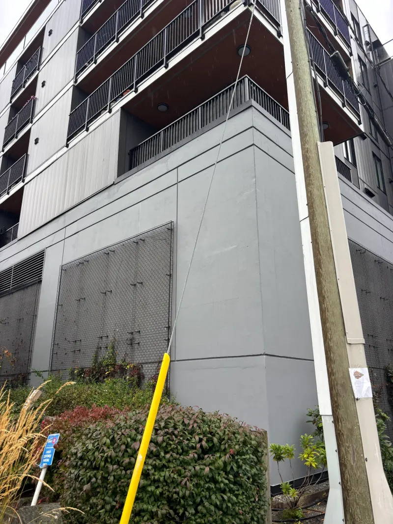 After: Upward angled view of freshly painted side elevation wall, Downtown, Squamish, BC
