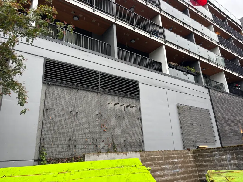 After: Freshly painted front wall section with vents and screens, Downtown, Squamish, BC