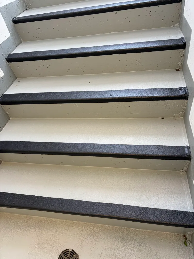 After: Close view of newly painted stair treads with black nosing and light gray risers, Downtown, Squamish, BC