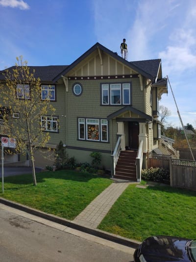 Completed commercial fourplex exterior repaint in East Vancouver, BC, after photo one