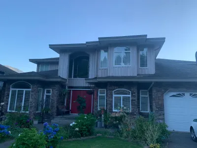 Before: front, beige siding with red door, Garibaldi Highlands Squamish