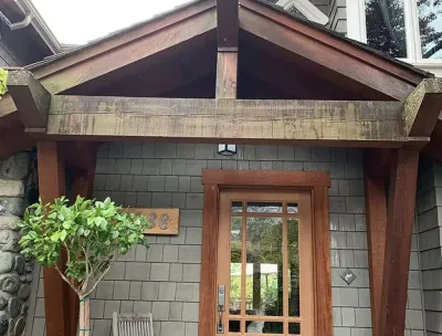 Before: Front entry with weathered timber beams and cedar shingles, Garibaldi Highlands
