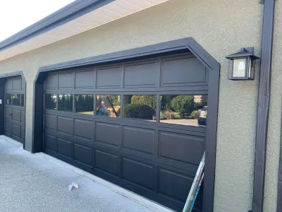After: front view, grey stucco