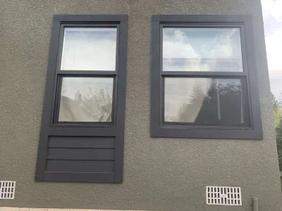 After: side wall, grey stucco