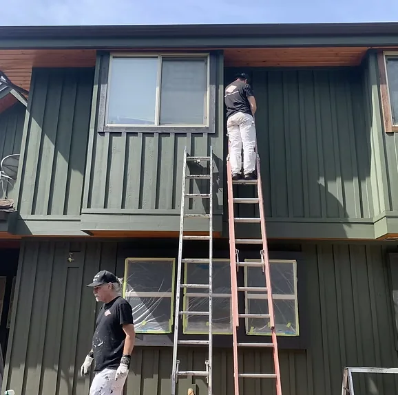 Before: Colour Craft crew on ladders beginning the restoration project, Garibaldi Highlands