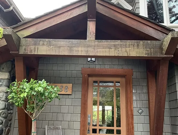 Before: Front entry with weathered timber beams and cedar shingles, Garibaldi Highlands