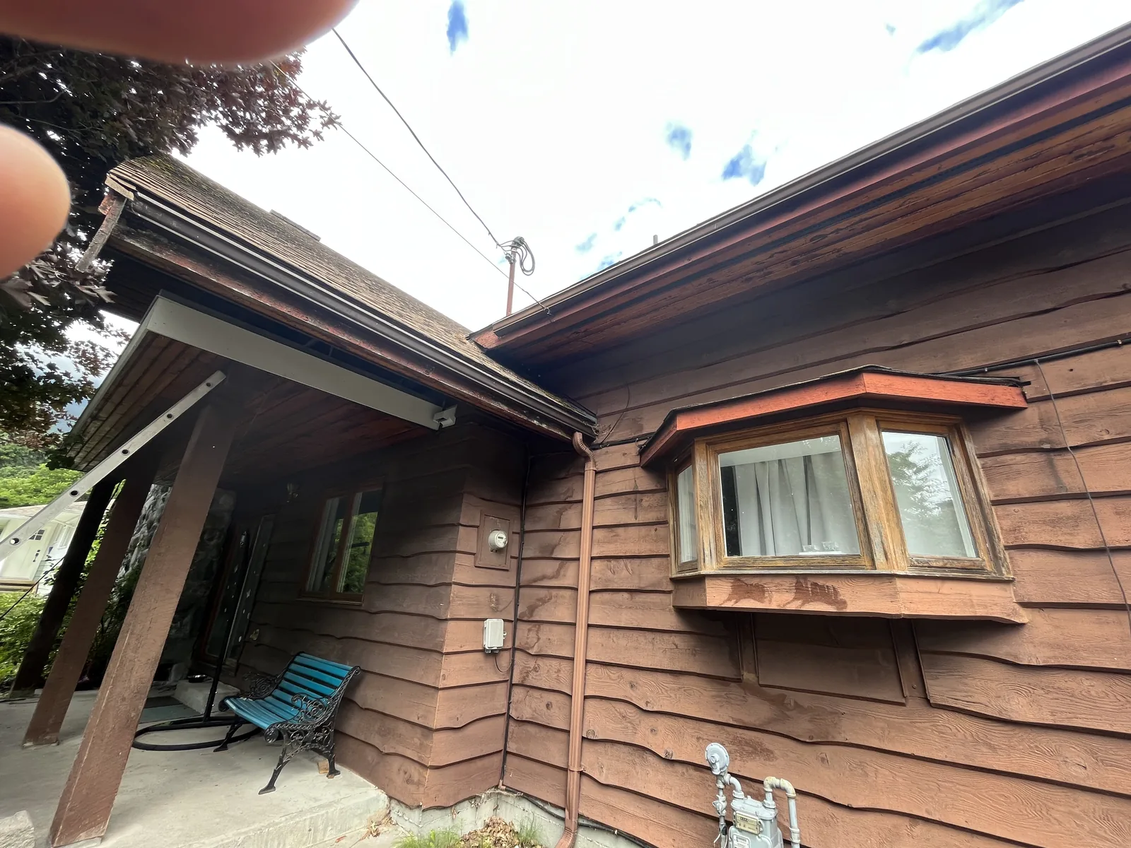 Before: Kristen residence side view, peeling and faded siding, Brackendale