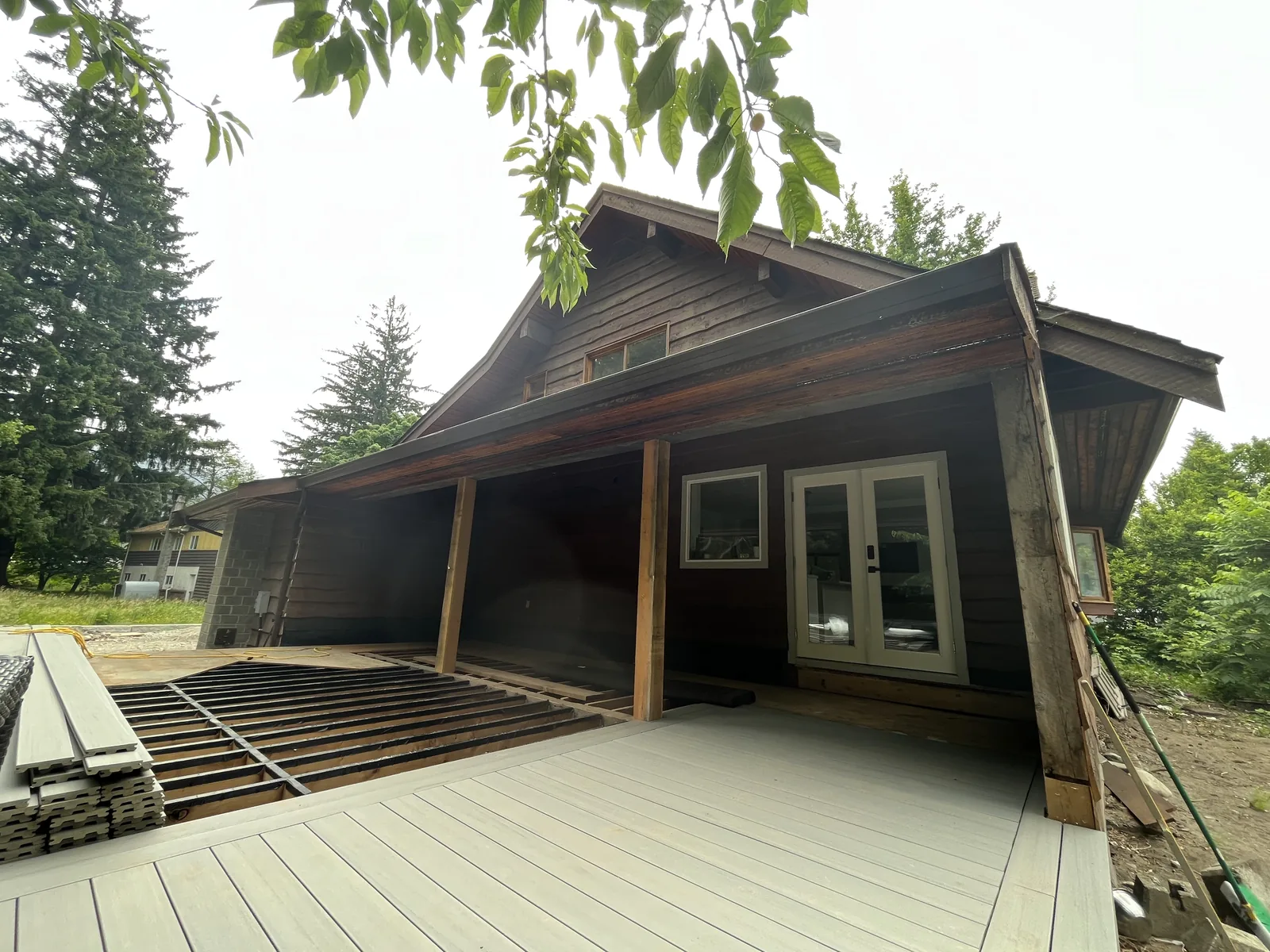Before: Kristen residence deck area, weathered wood, Brackendale