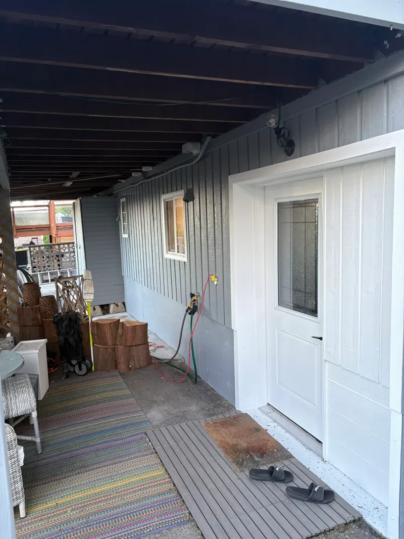 After: Covered side walkway with door, window, and siding along the house, New Westminster, BC