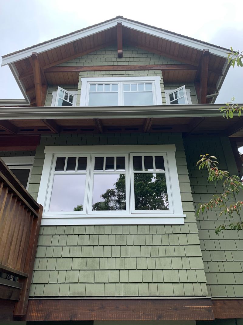 Completed green siding and natural wood framing at this North Vancouver home