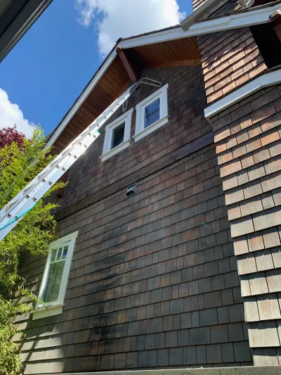 Before stain restoration, exterior view five at this North Vancouver home