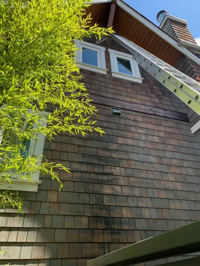 Before siding and trim restoration at this North Vancouver home