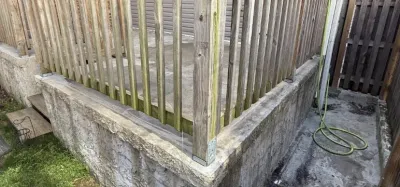 Before fence staining, Philadelphia PA, grey weathered wood with algae