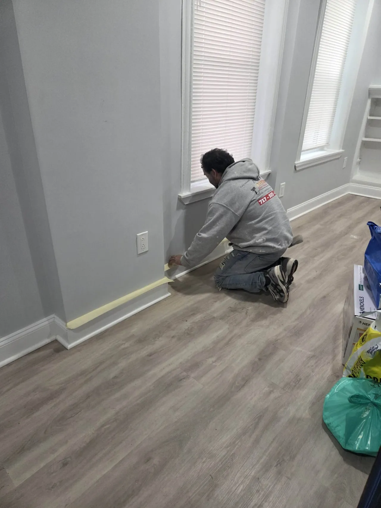 Colour Craft painter cutting in a wall in a Philadelphia home