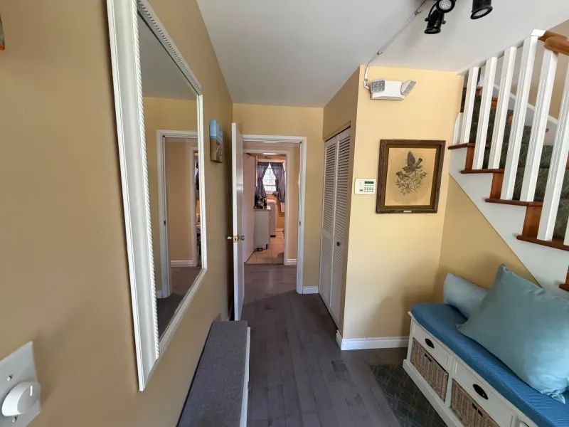 Before: Hallway with mirror, closet door, and staircase railing, Seafair, Richmond, BC