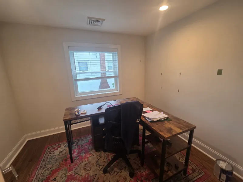 Before: Home office with light walls, white trim, and window before repainting, Springfield, PA