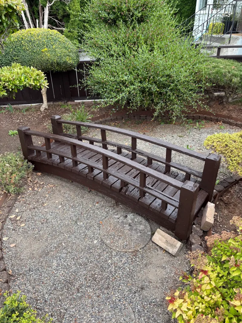 After: Repainted garden footbridge over a gravel landscape bed, Steveston, Richmond, BC