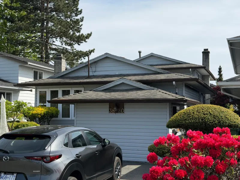 Before: Front elevation of house with siding, roofline, and attached garage before painting, Steveston, Richmond, BC