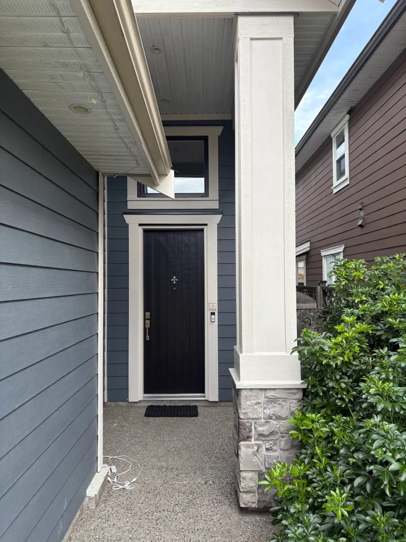 After: Front entry with covered porch, column, siding, door, and transom window, Steveston, Richmond, BC