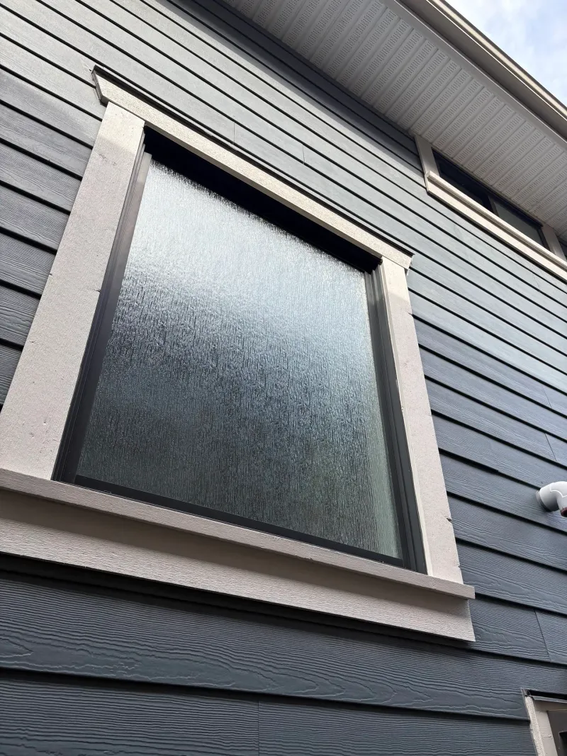 After: Close view of upper window with trim and siding, Steveston, Richmond, BC