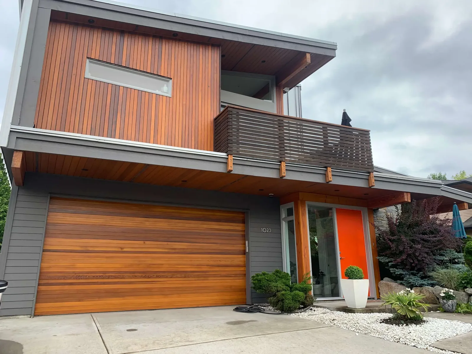 After: Full Cedar Wood Restoration Squamish BC, warm amber stain completed house