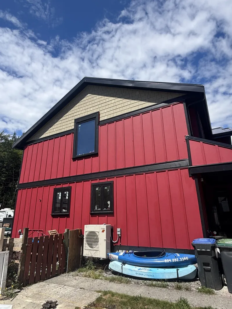 After exterior repaint with red siding and black trim at this home in Valleycliffe, Squamish BC