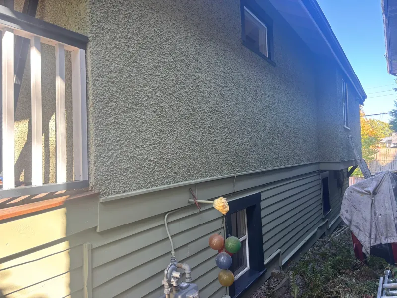 After: Side elevation wall with upper textured surface and lower siding, windows below, Vancouver, West Vancouver, BC