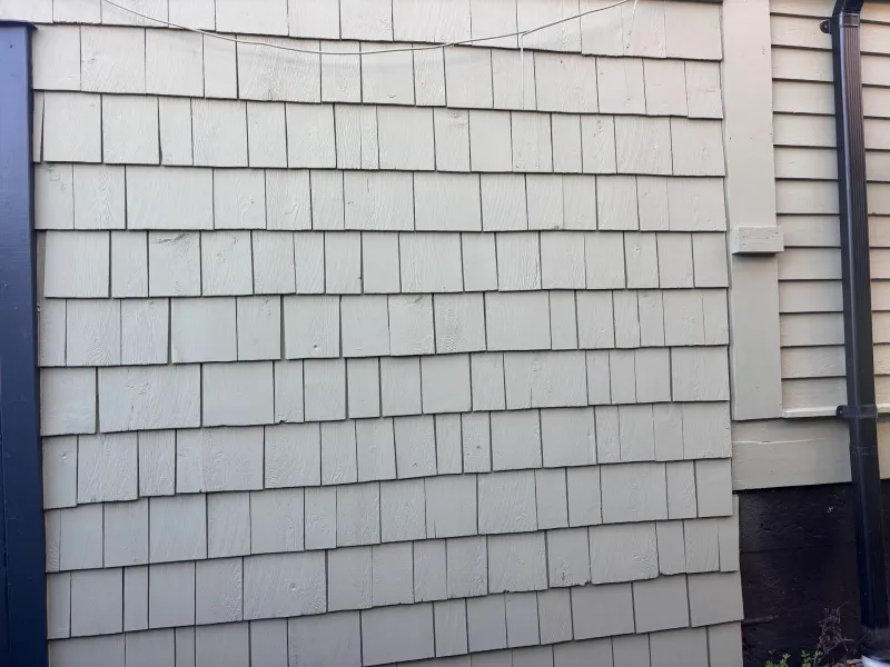 After: Close view of shingled wall section with gutter downspout, Vancouver, West Vancouver, BC