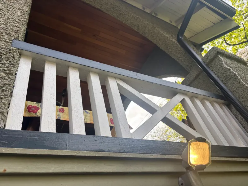 Before: Close view of deck railing and underside of eave trim, Vancouver, West Vancouver, BC
