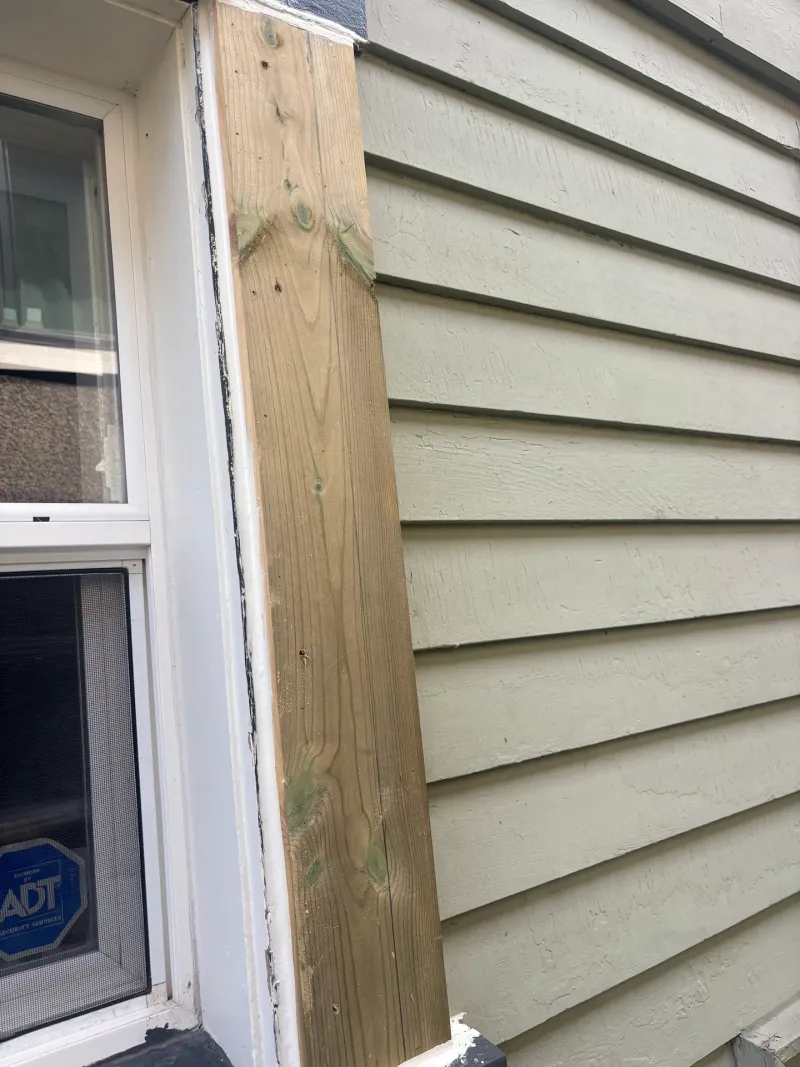 Before: Close detail of a new trim board beside a window, Vancouver, West Vancouver, BC