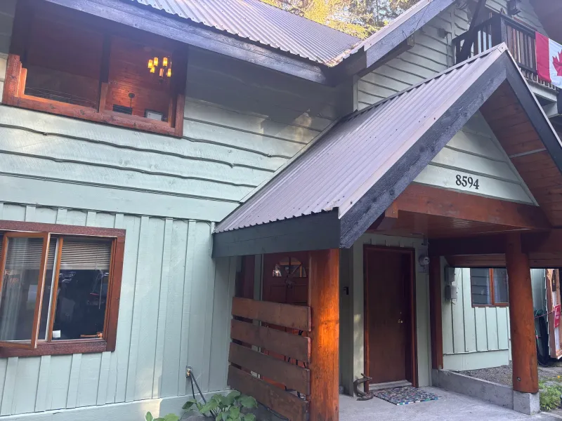 After: Front entry gable with door and trim after painting, Whistler, BC