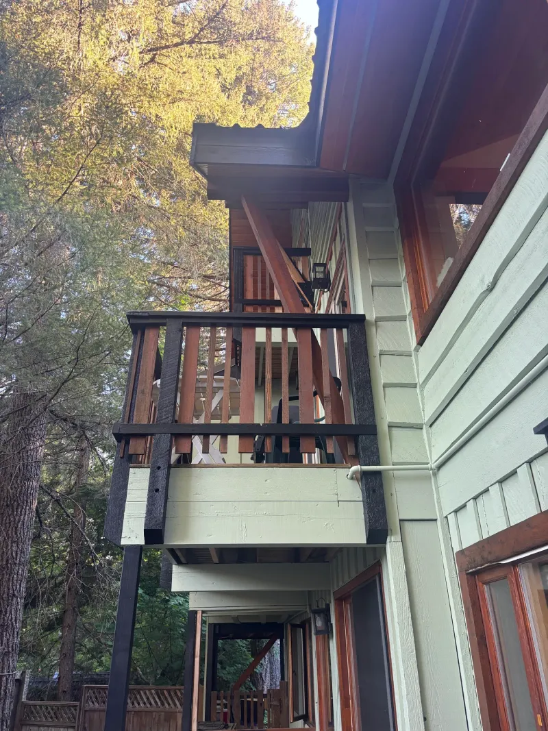After: Side elevation detail showing balcony structure and lower deck after painting, Whistler, BC