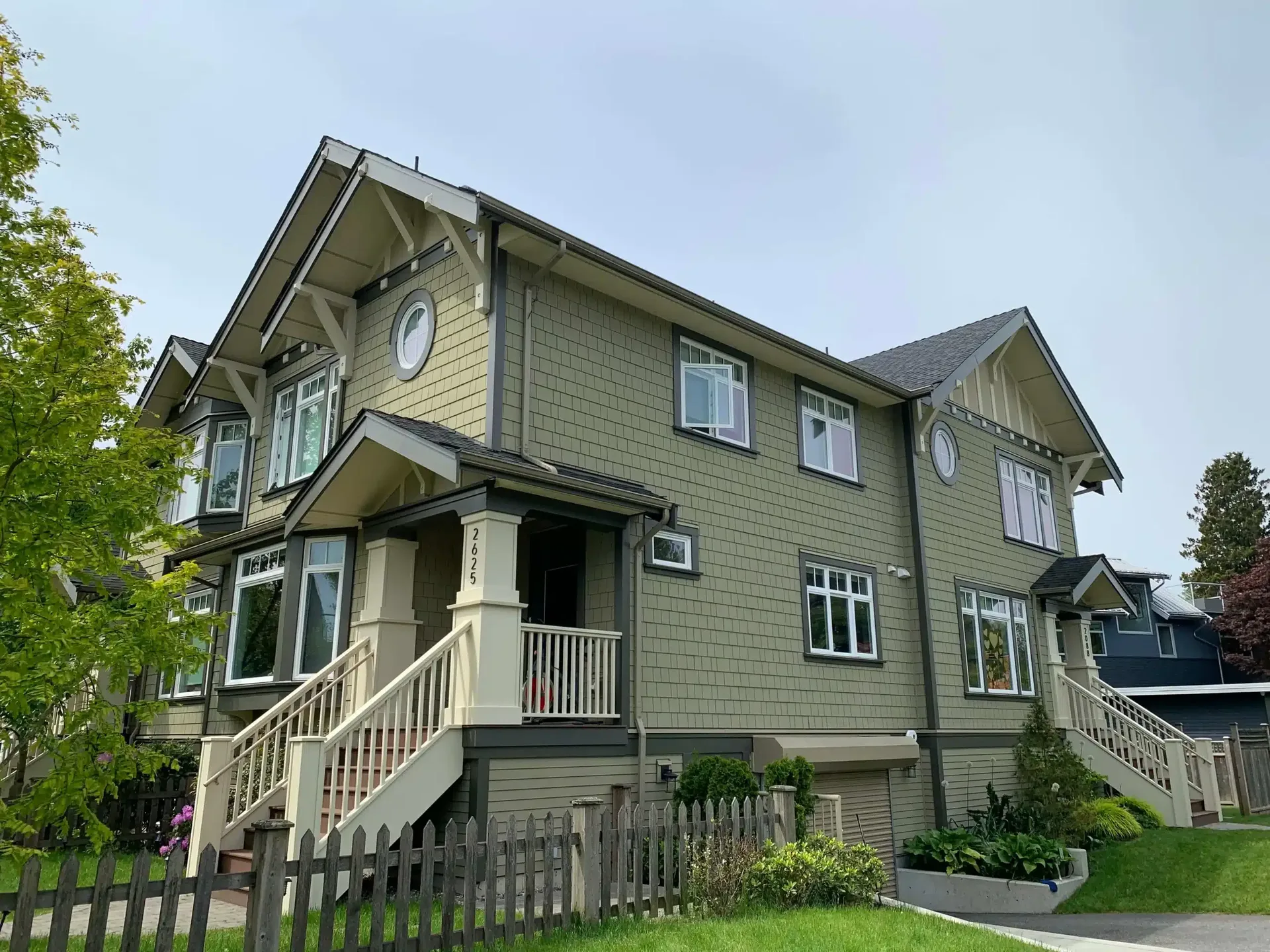 Repainted craftsman home with sage green siding