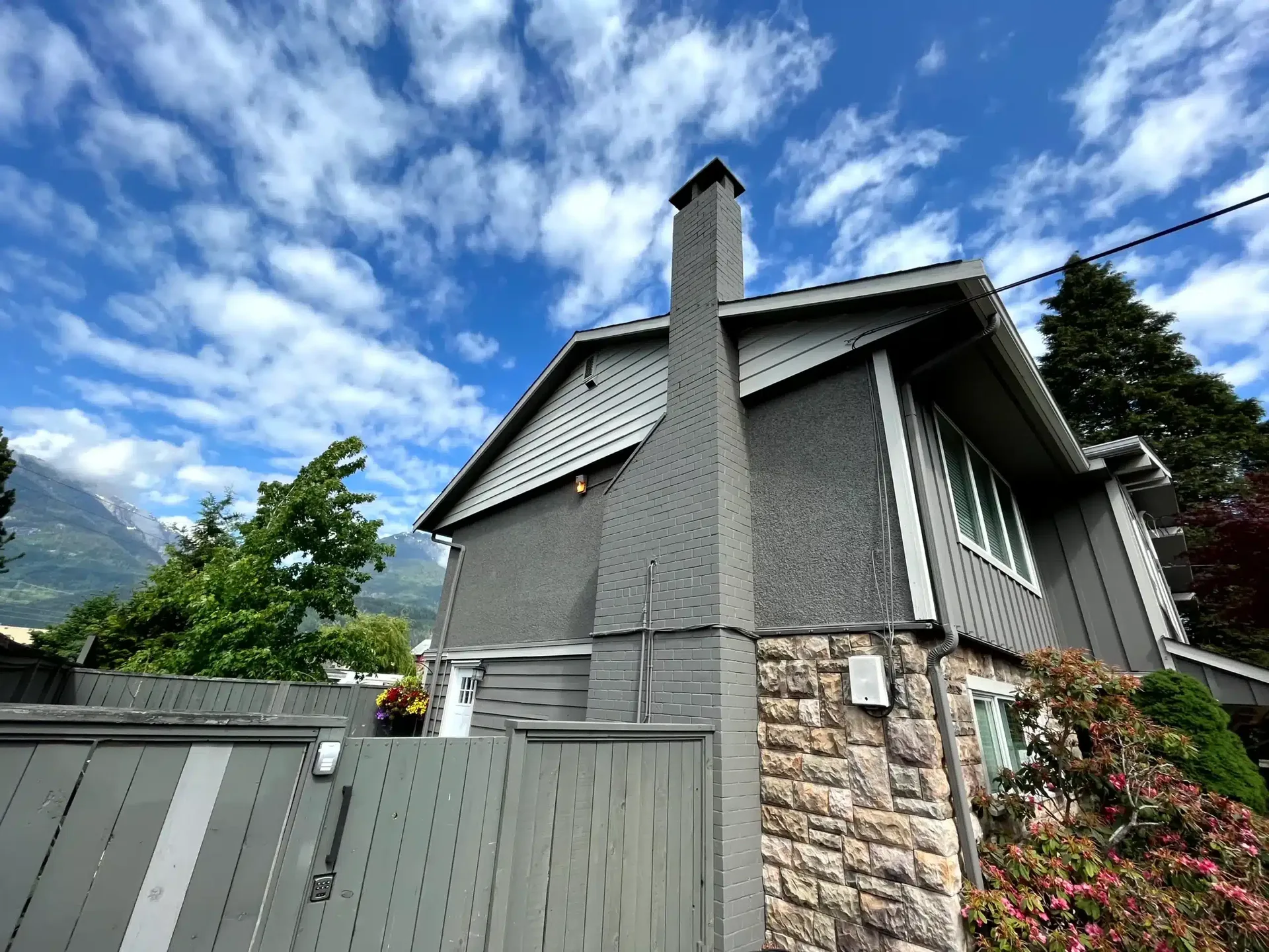 Home exterior side profile with cedar shingle siding