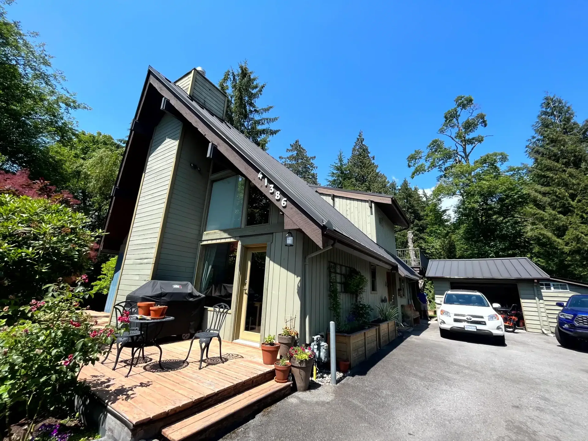 A-frame home exterior with stained wood siding