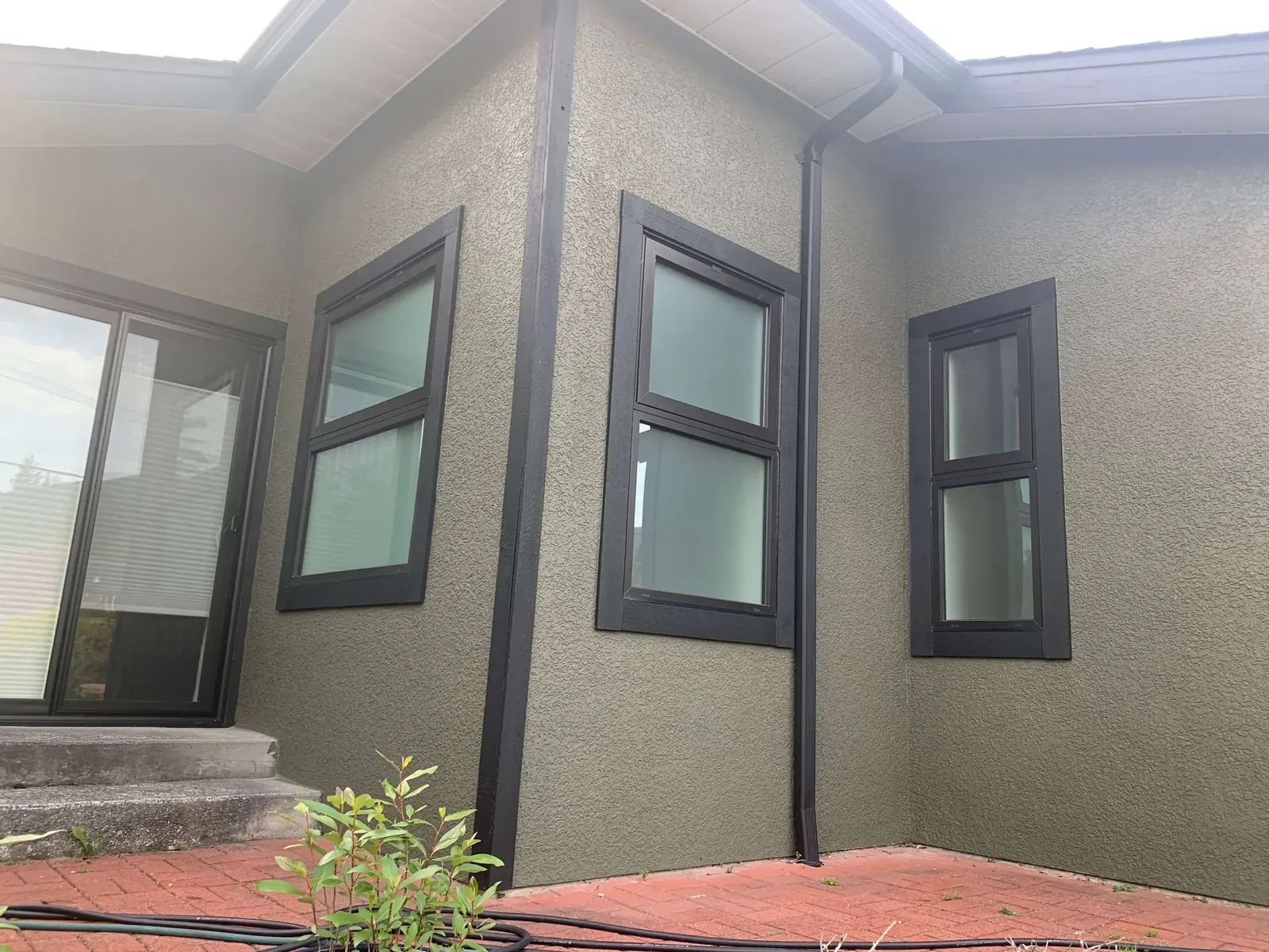 After — Amy residence side view, grey stucco