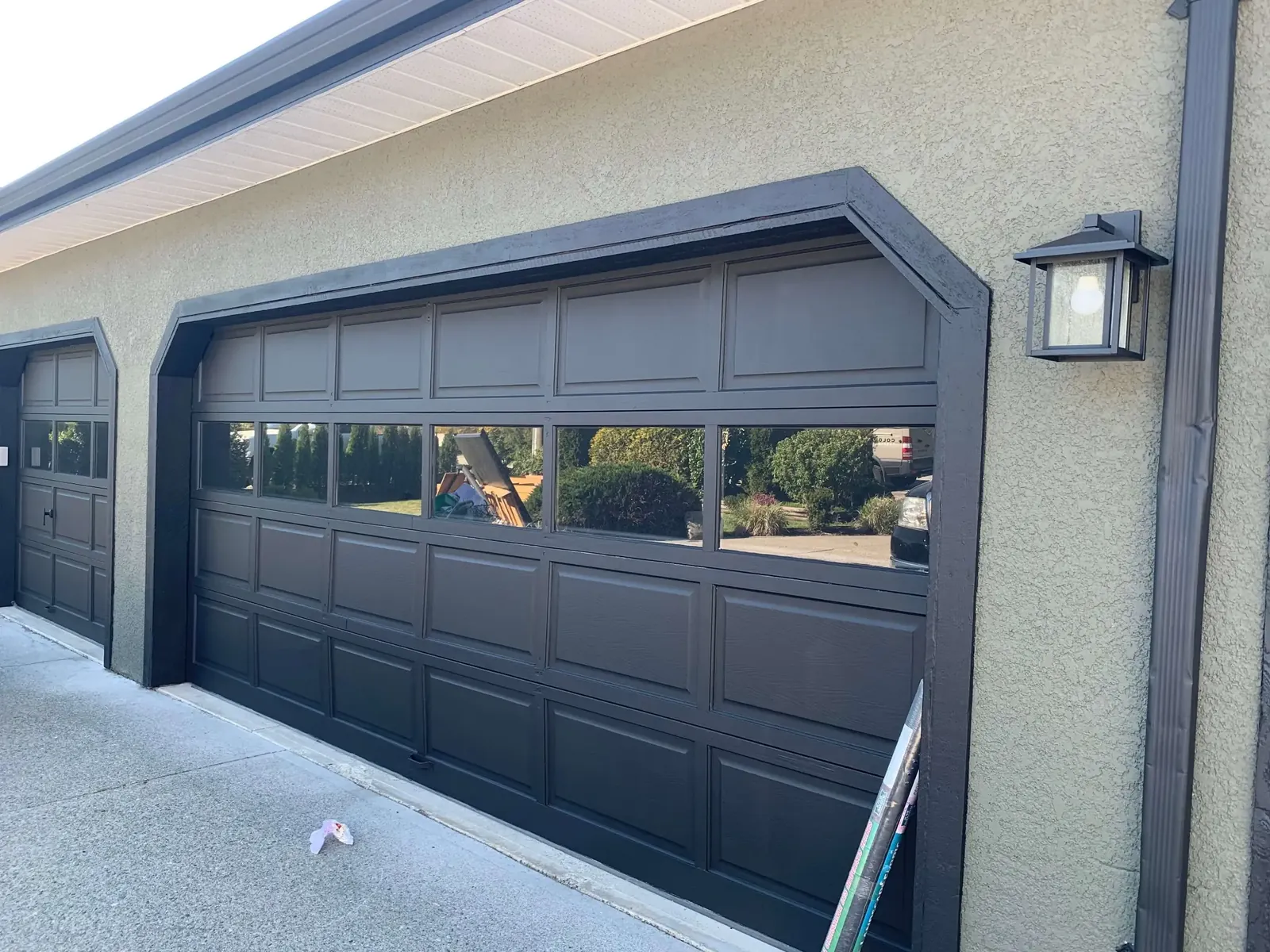 After — Amy residence front view, grey stucco