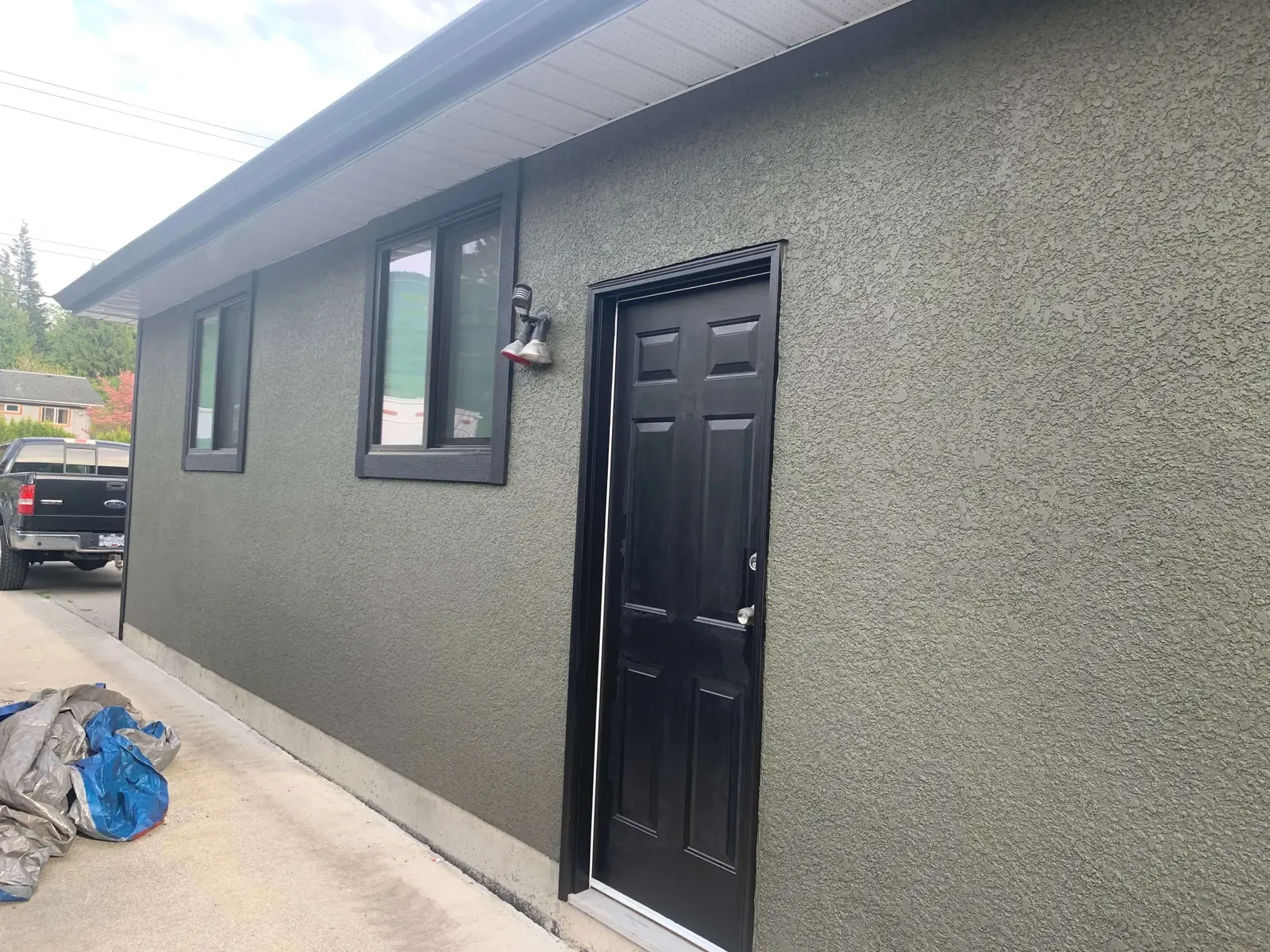 After — Amy residence corner detail, grey stucco