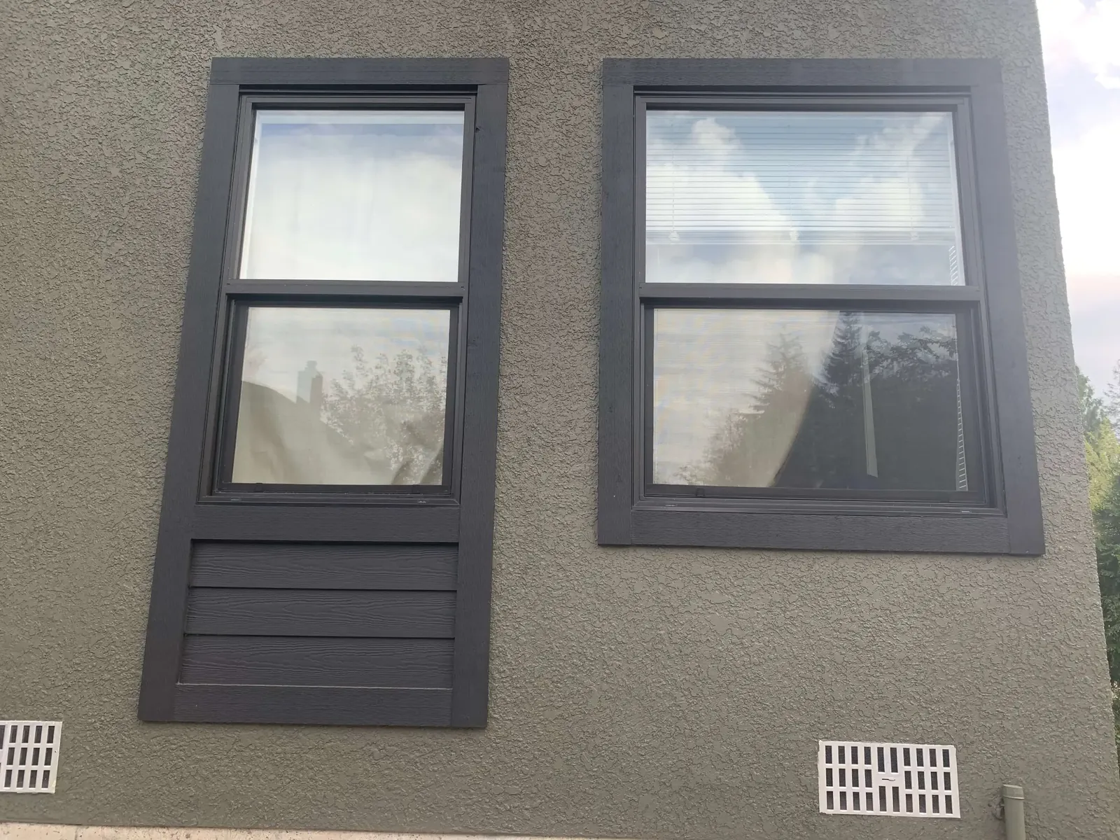 After — Amy residence side wall, grey stucco