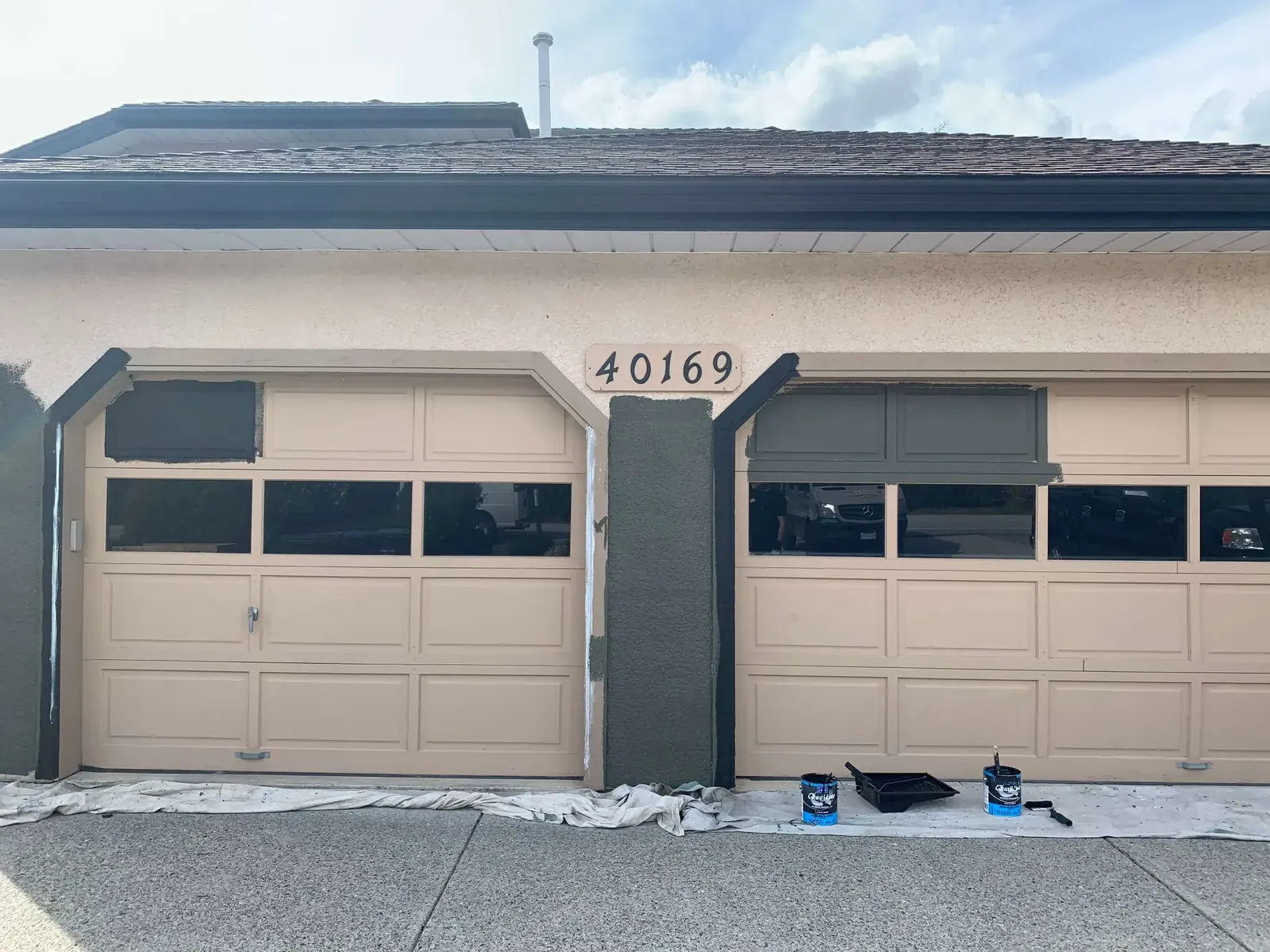 Before — Amy residence tan garage doors, Garibaldi Highlands