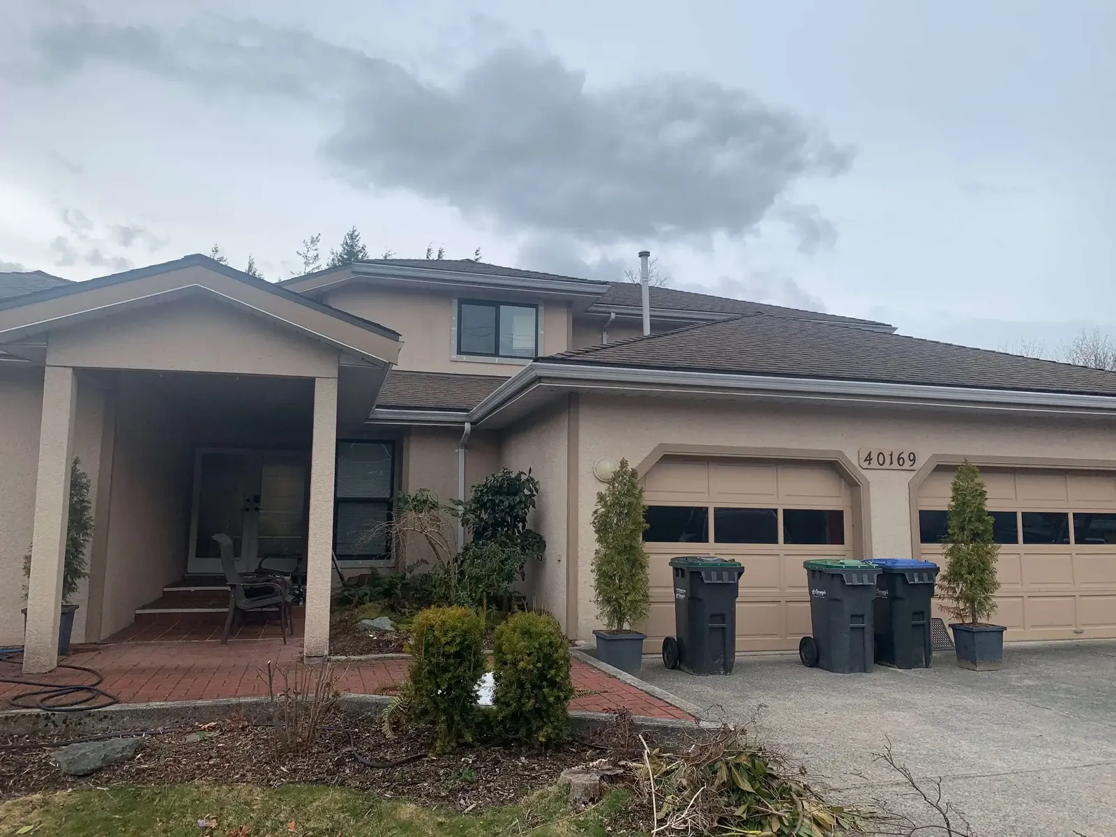 Before — Amy residence front view, beige stucco