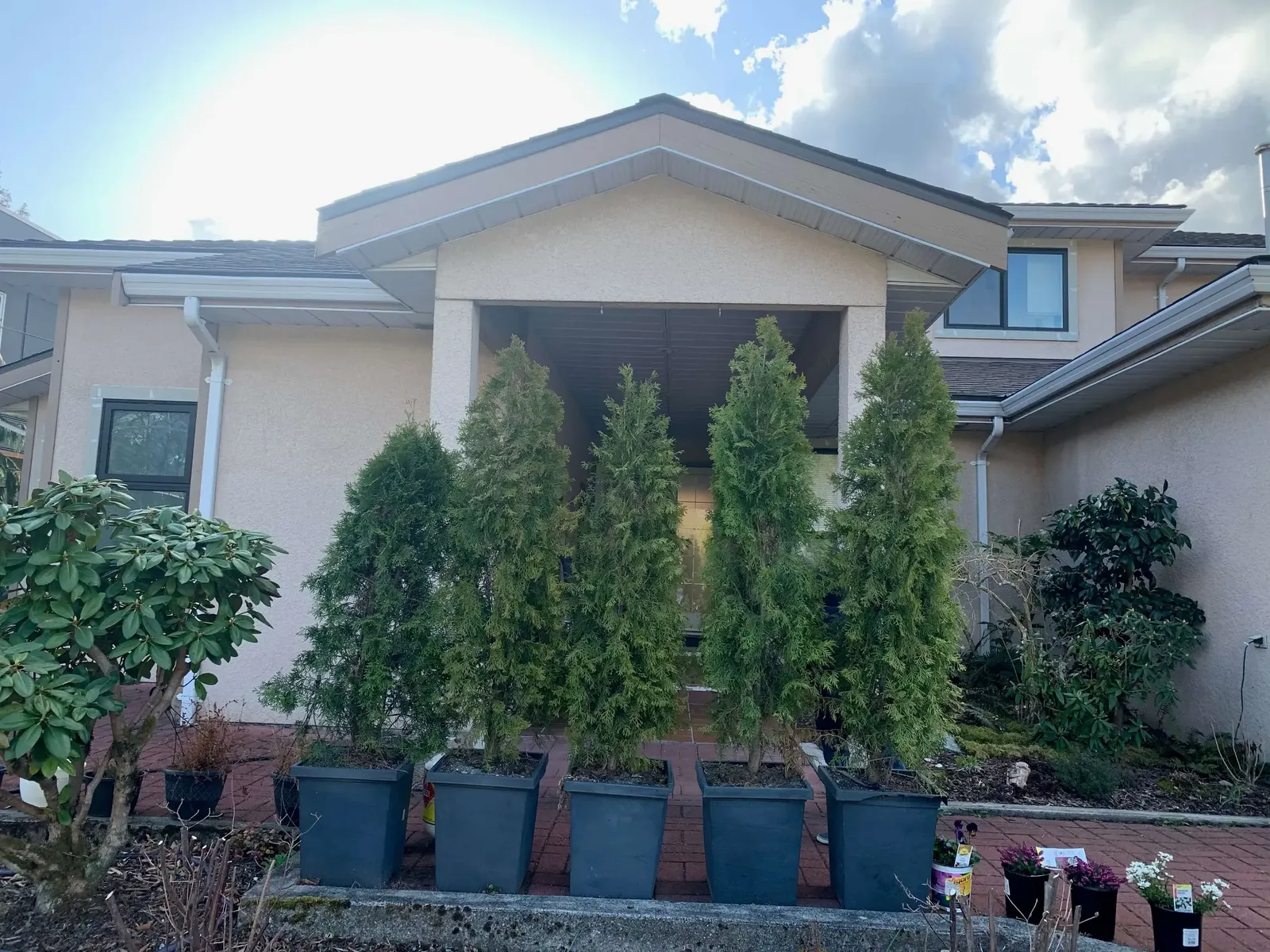 Before — Amy residence side wall, beige stucco