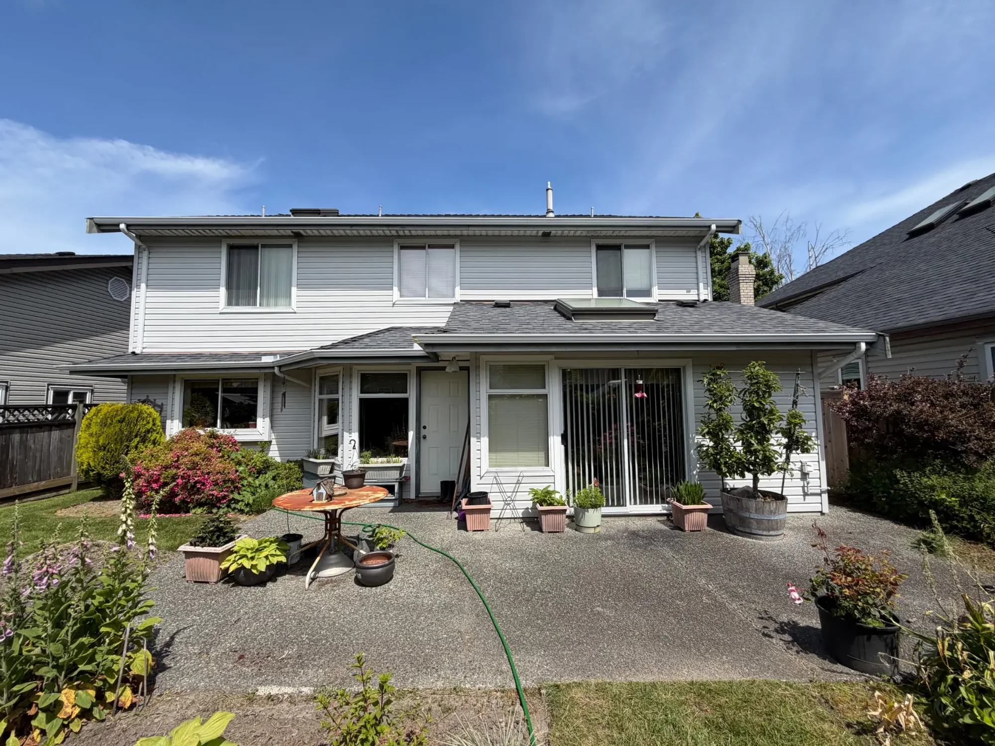 Before rear exterior view at Dick’s Ladner home in Delta, BC