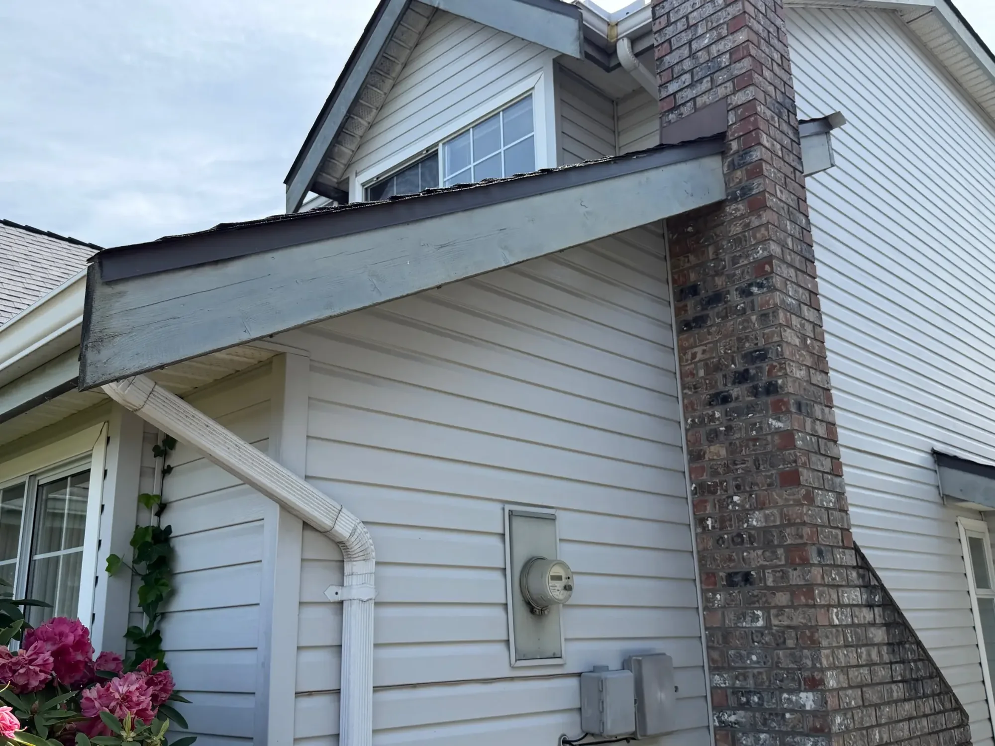Before fascia and chimney-side trim detail at Dick’s Ladner home in Delta, BC